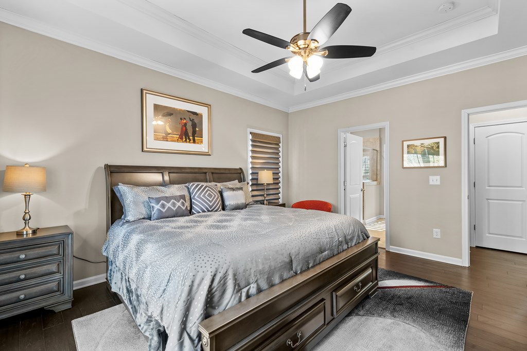 96 Morgan Trail Ellijay, GA 30536 - Photo 35 of 48 a bedroom with a bed and a chandelier