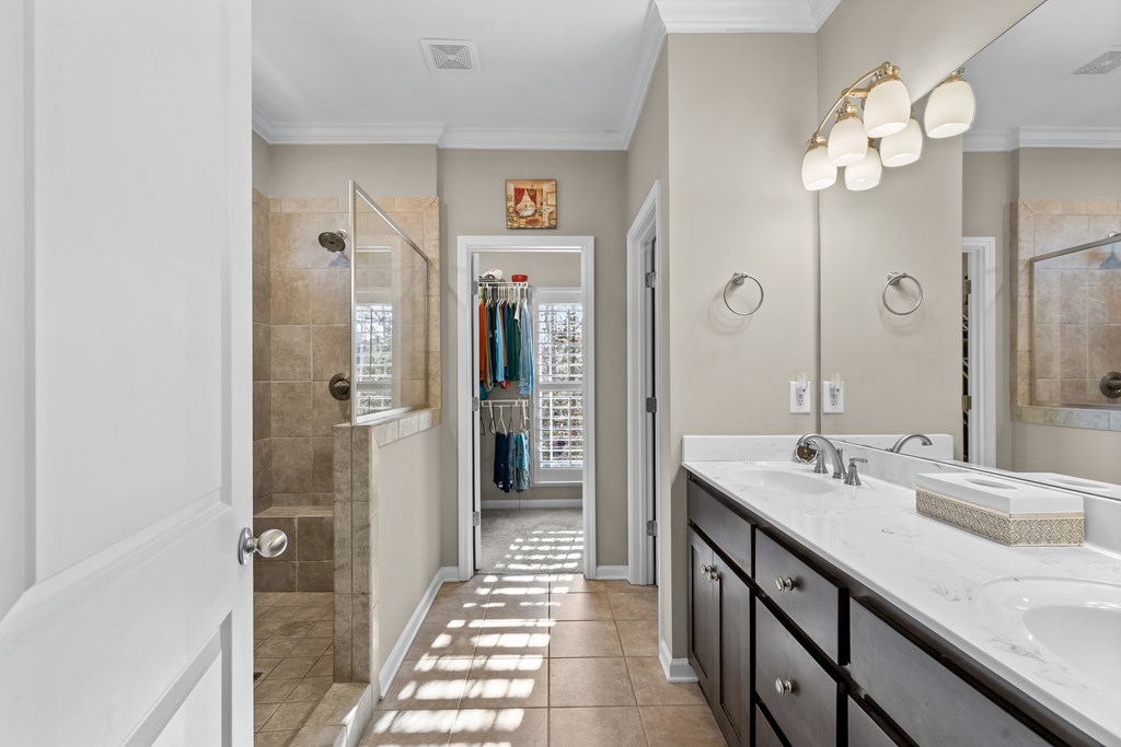 96 Morgan Trail Ellijay, GA 30536 - Photo 36 of 48 a spacious bathroom with a granite countertop sink a mirror and shower