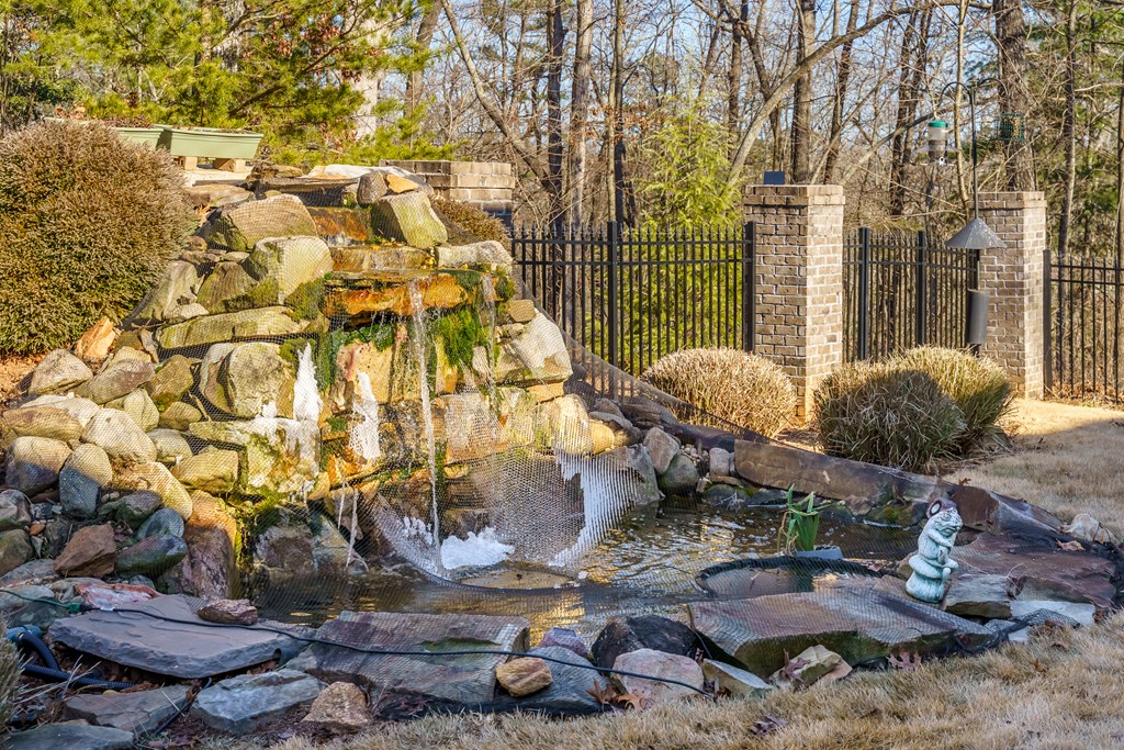 96 Morgan Trail Ellijay, GA 30536 - Photo 4 of 48 a backyard of a house with a fountain table and chairs