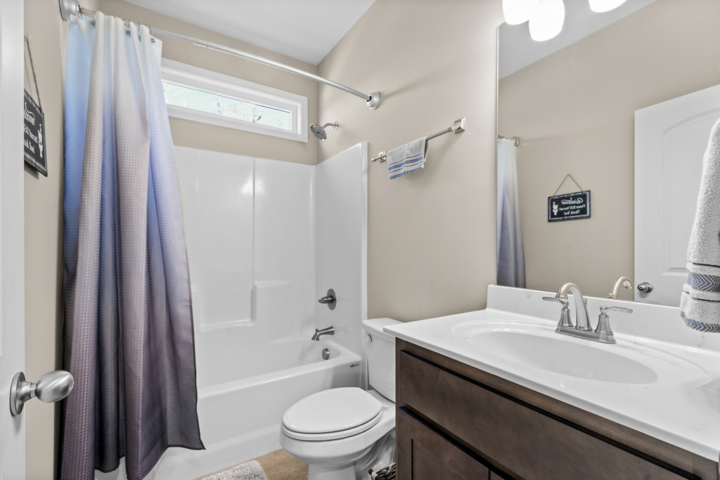 96 Morgan Trail Ellijay, GA 30536 - Photo 42 of 48 a bathroom with a granite countertop sink toilet and shower