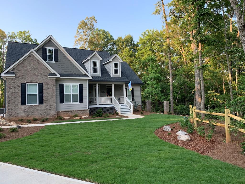 96 Morgan Trail Ellijay, GA 30536 - Photo 48 of 48 a front view of a house with a garden and trees