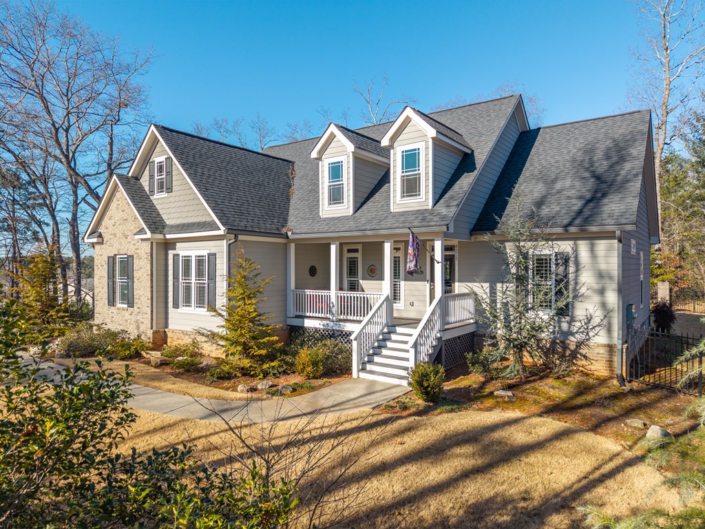 96 Morgan Trail Ellijay, GA 30536 - Photo 6 of 48 a front view of a house with yard porch and seating