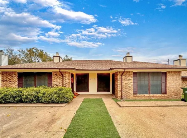 a front view of a house with yard