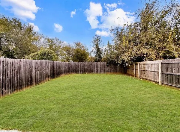 a view of a backyard with green space