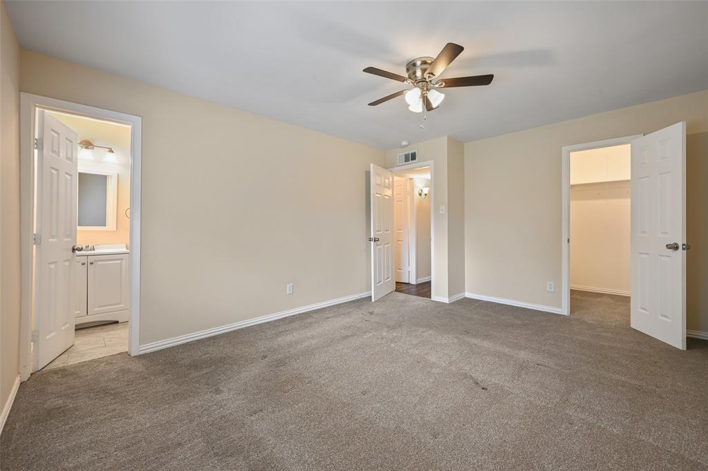 7318 Emory Oak Lane Dallas, TX 75249 - Photo 15 of 28 Carpeted room featuring a ceiling fan with integrated lighting