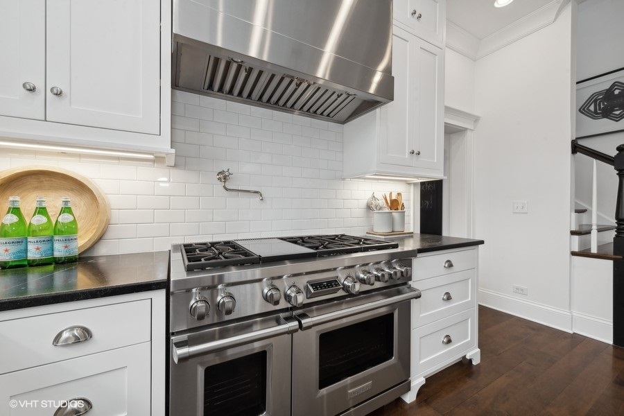 383 West County Line Road Barrington Hills, IL 60010 - Photo 19 of 75 a stove top oven sitting inside of a kitchen