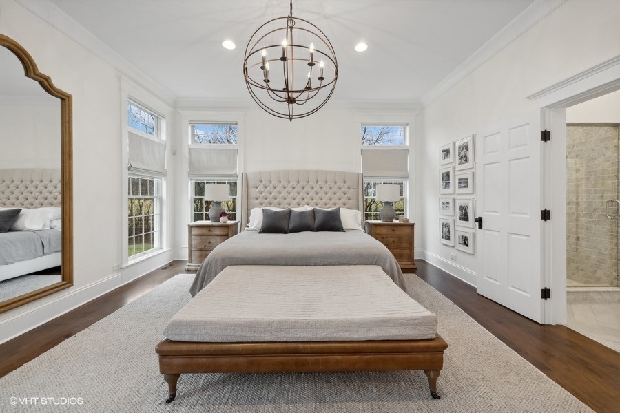 383 West County Line Road Barrington Hills, IL 60010 - Photo 29 of 75 a spacious bedroom with a bed mirror and a window