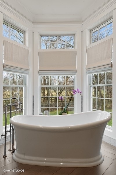 383 West County Line Road Barrington Hills, IL 60010 - Photo 33 of 75 a living room with a large window and table