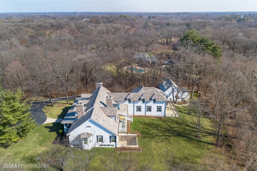383 West County Line Road Barrington Hills, IL 60010 - Photo 4 of 75 an aerial view of a house with a yard