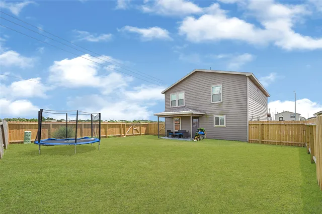 a view of a house with a big yard