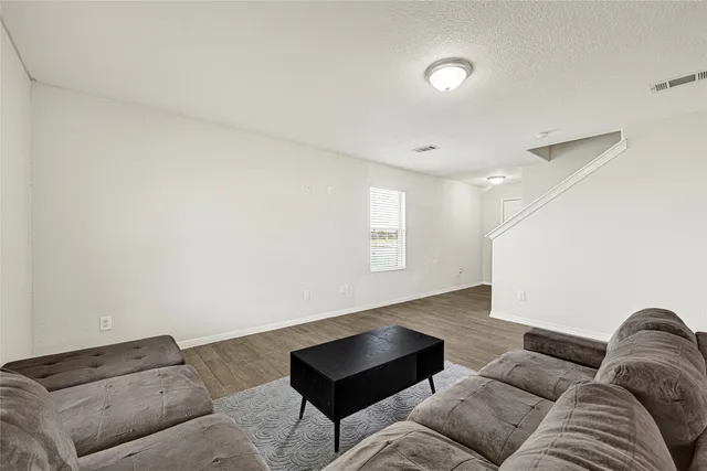 a living room with furniture and a couch