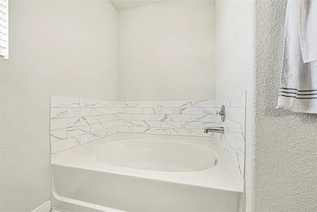 a bathroom with a bathtub