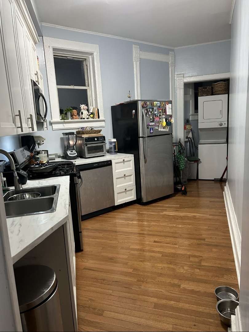 1332 West 18th Street, Unit 3F Chicago, IL 60608 - Photo 2 of 5 a kitchen with stainless steel appliances a stove a refrigerator and a sink