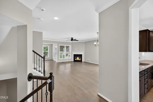 a view interior of a house with wooden floor fireplace and windows