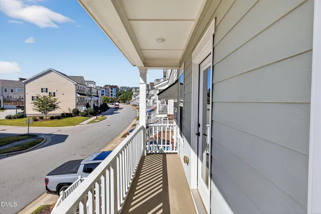 a view of a hall with wooden floor