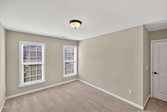 a bathroom with a bathtub shower sink vanity and mirror
