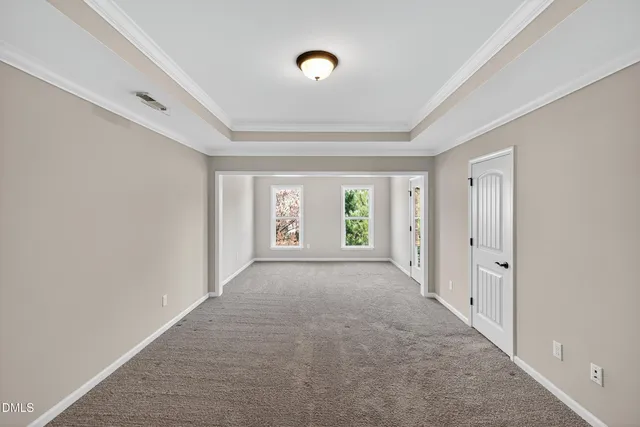 a bathroom with a granite countertop sink a large mirror and a shower
