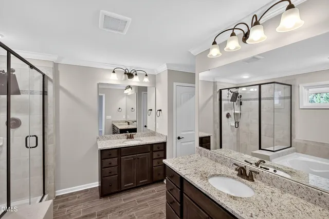 a bathroom with a granite countertop sink mirror and shower