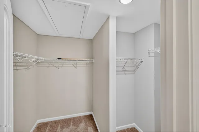 a bathroom with a bathtub shower sink vanity mirror and toilet