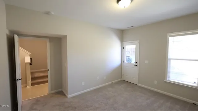 a view of a building with a yard