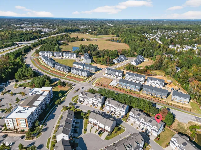 an aerial view of a house with swimming pool