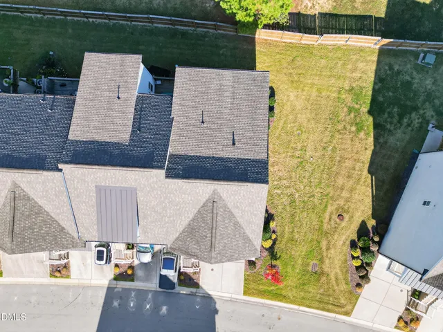 aerial view of a house with a swimming pool outdoor seating