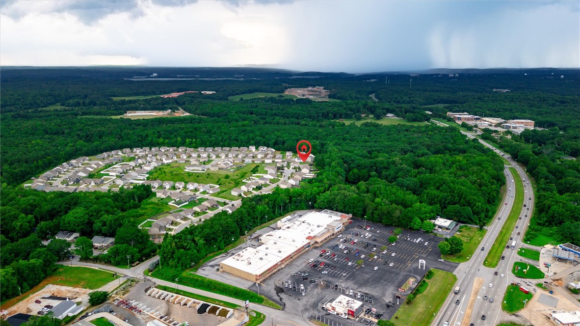 34 Karkinnen Court Pendleton, SC 29670 - Photo 35 of 36 An aerial perspective reveals a vibrant neighborhood nestled among lush woodlands, offering a blend of residential tranquility and commercial convenience.