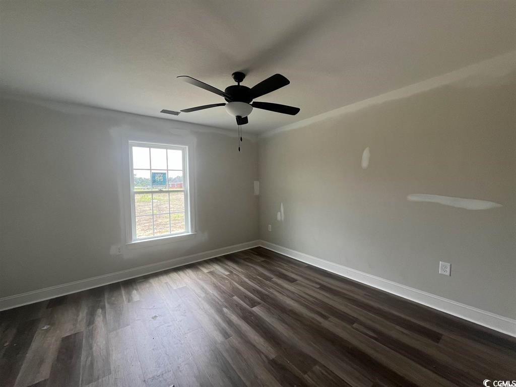 8187 Kerl Road Aynor, SC 29511 - Photo 12 of 14 Empty room with dark wood-type flooring and ceilin