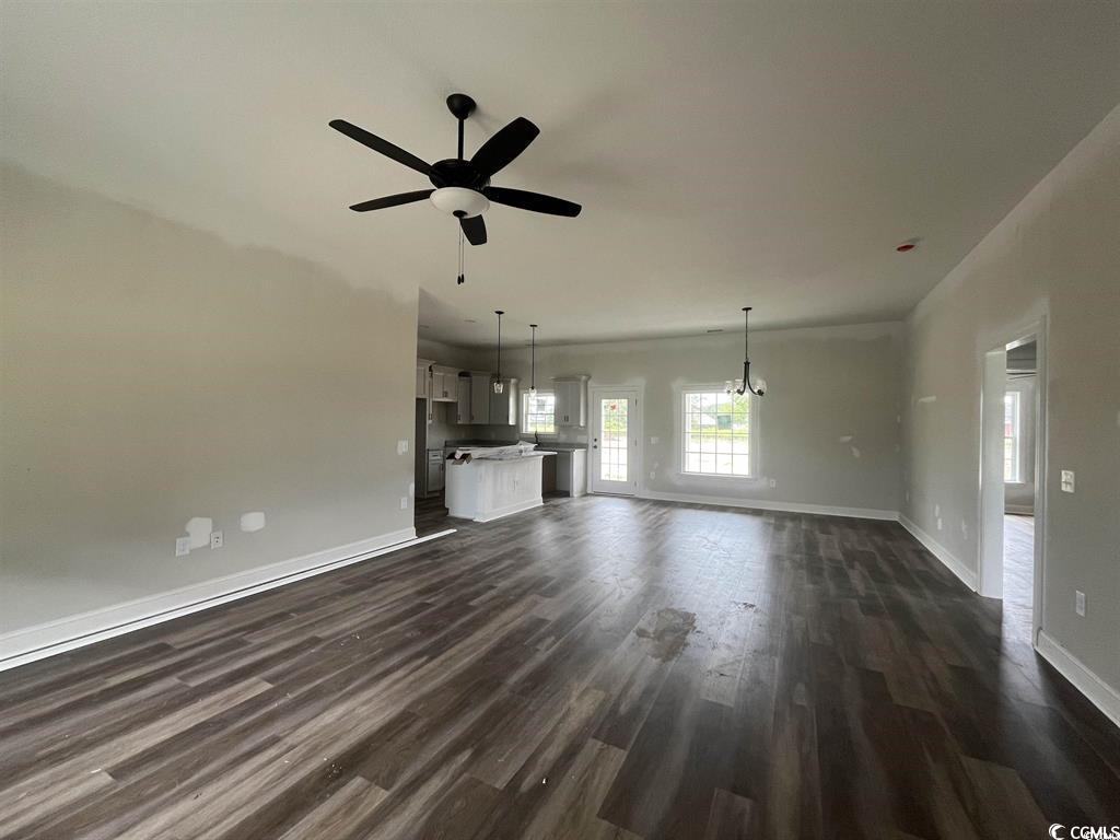 8187 Kerl Road Aynor, SC 29511 - Photo 2 of 14 Unfurnished living room with ceiling fan and dark