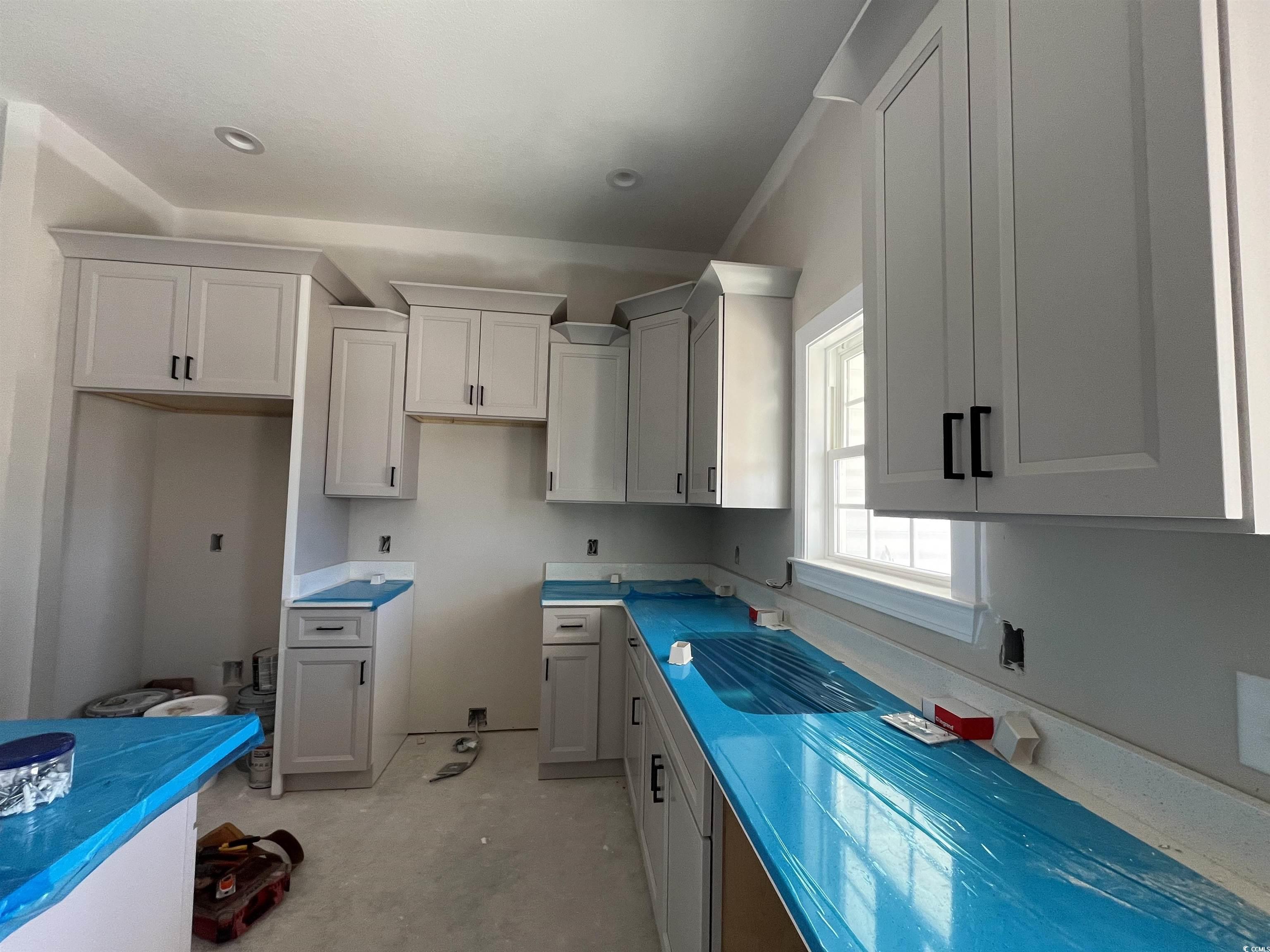 8187 Kerl Road Aynor, SC 29511 - Photo 5 of 14 Kitchen with white cabinetry