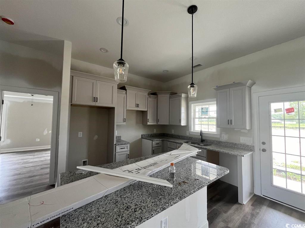 8187 Kerl Road Aynor, SC 29511 - Photo 6 of 14 Kitchen with a center island, dark hardwood / wood