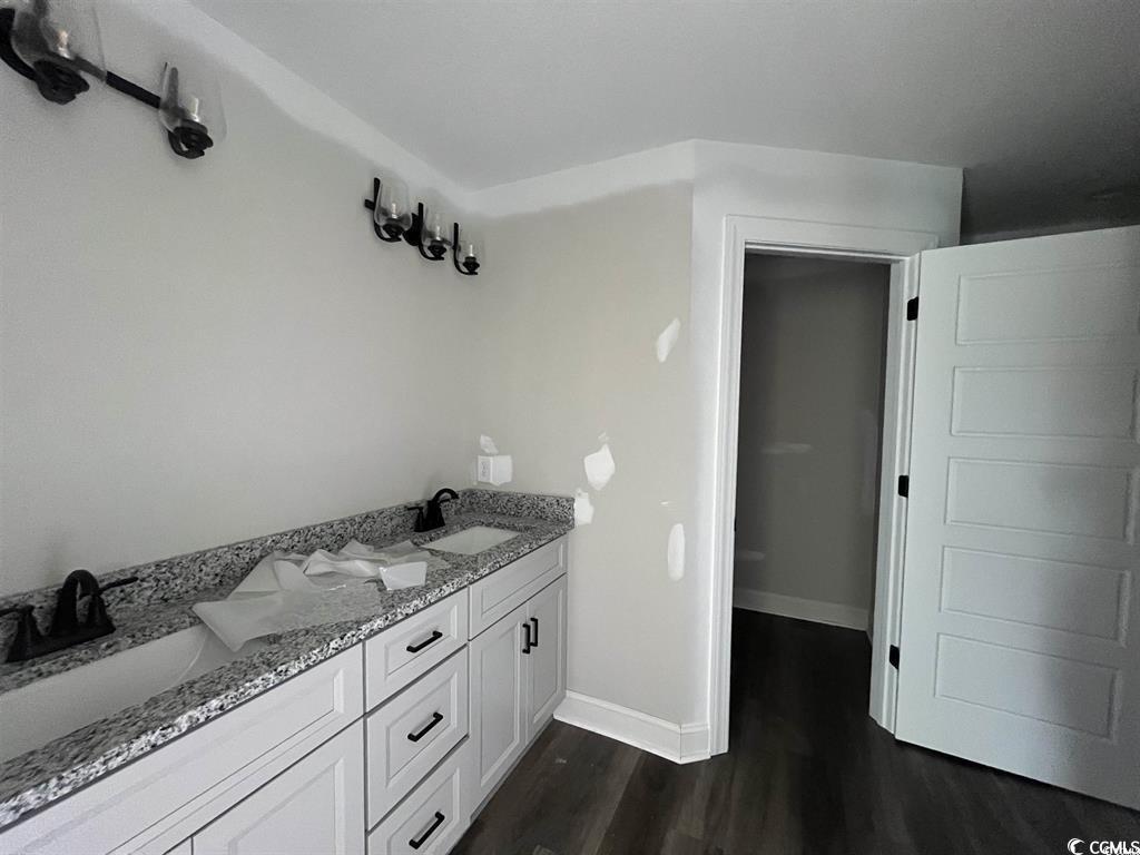 8187 Kerl Road Aynor, SC 29511 - Photo 8 of 14 Bathroom featuring vanity and wood-type flooring