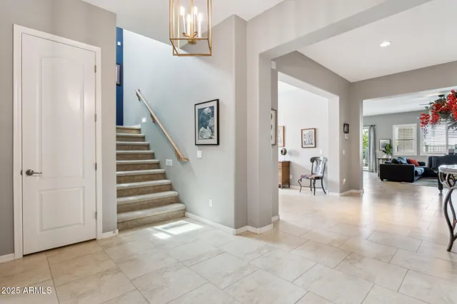 a large kitchen with a table and chairs