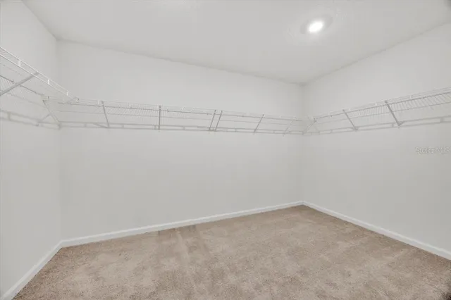 a view of a room with racks on the wall