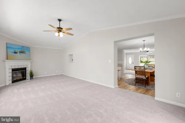 a view of empty room with a fireplace