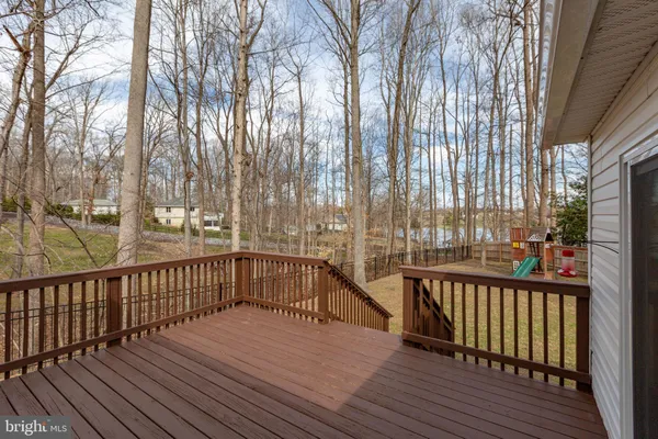 a view of a balcony with wooden floor