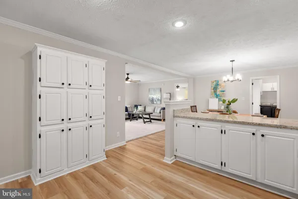 a spacious bathroom with double vanity and a mirror