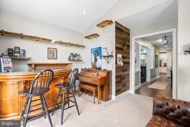 a view of a livingroom with furniture and a window