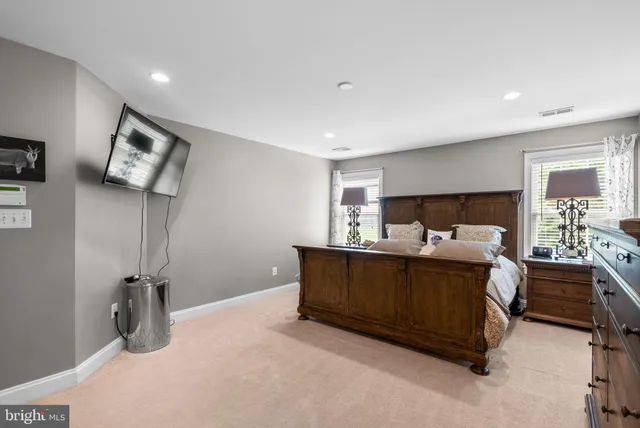 a living room with furniture and windows