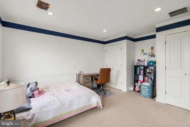 a view of a swimming pool with lawn chairs under an umbrella
