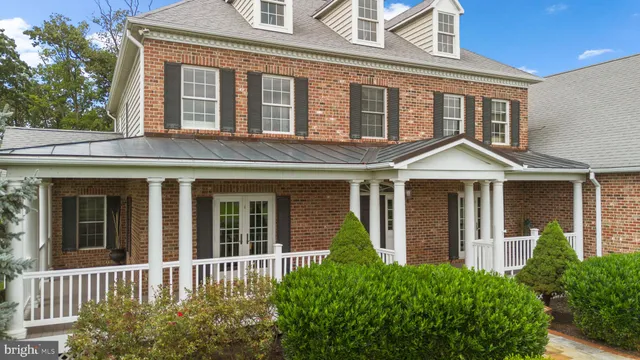 a living room with furniture flat screen tv and a fireplace