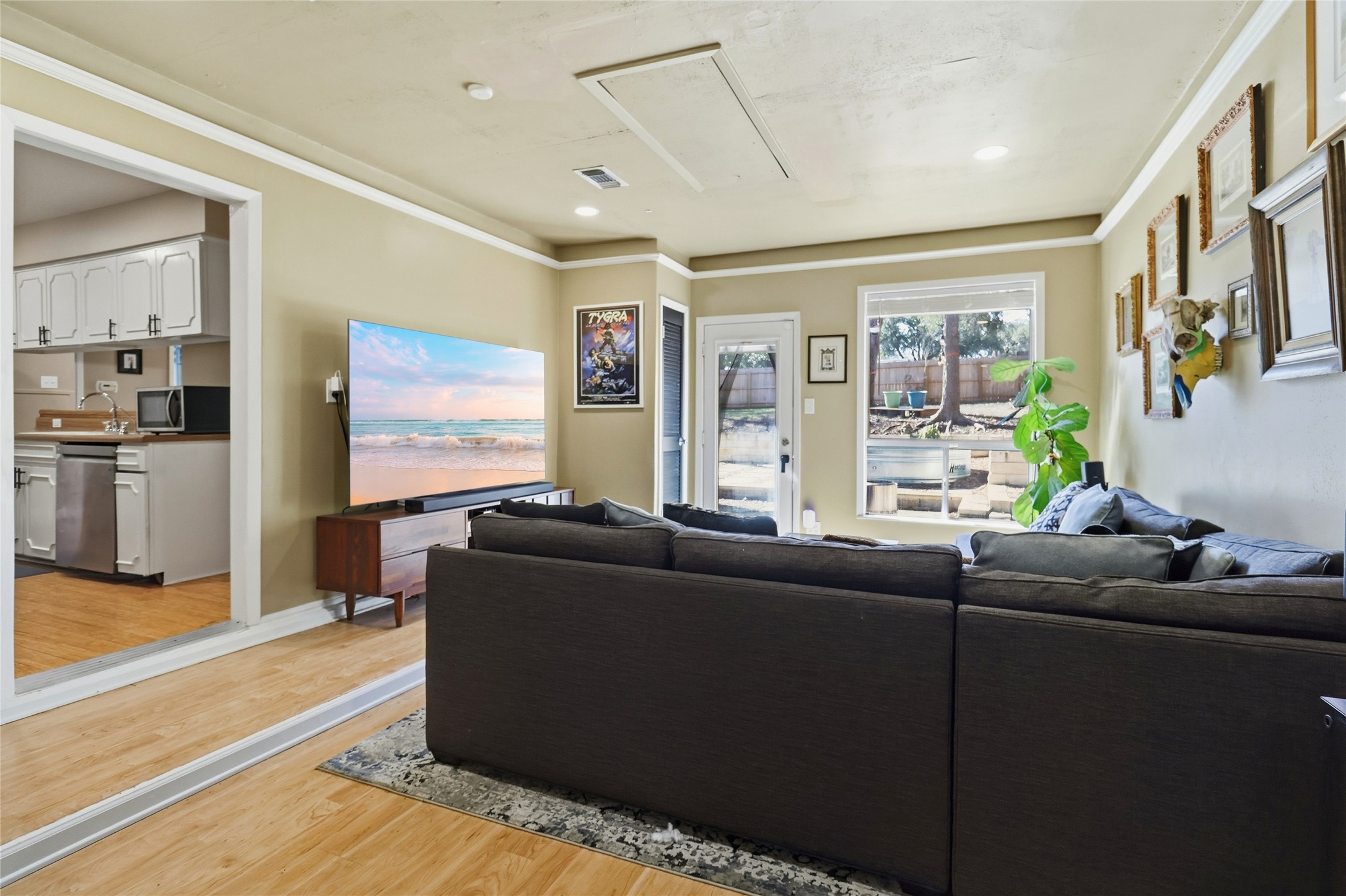 505 Lightsey Road Austin, TX 78704 - Photo 12 of 36 a living room with furniture and a flat screen tv