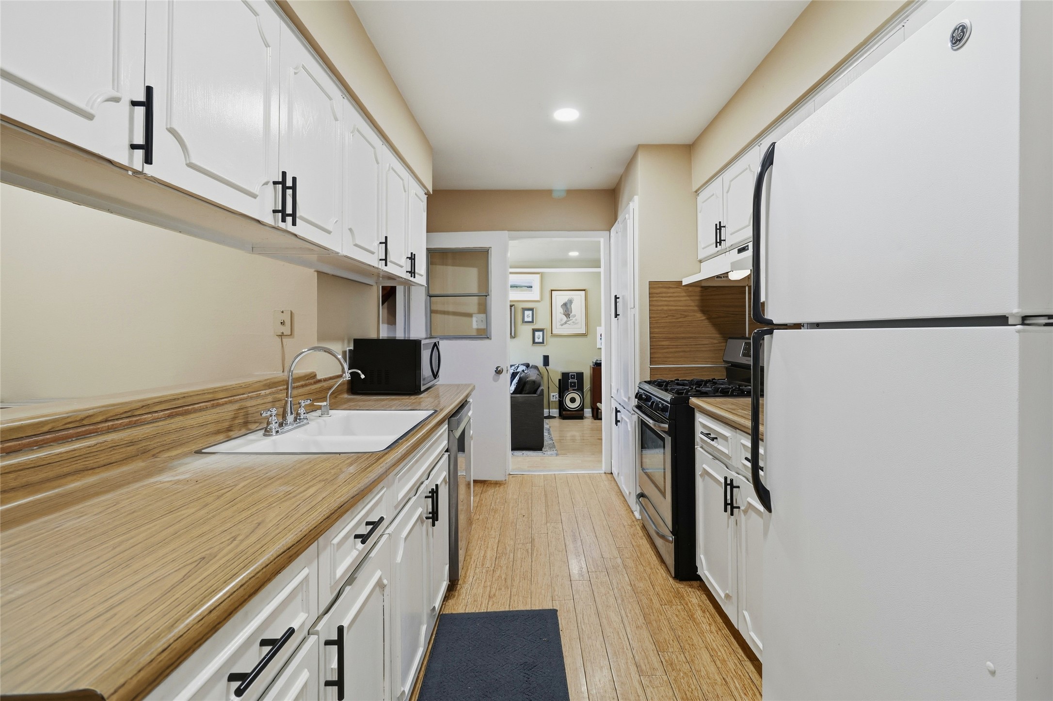 505 Lightsey Road Austin, TX 78704 - Photo 13 of 36 a kitchen with a sink appliances and cabinets