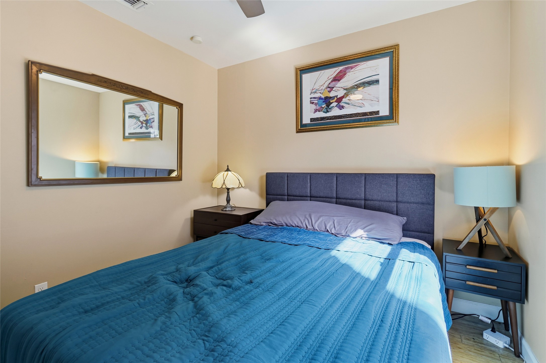 505 Lightsey Road Austin, TX 78704 - Photo 19 of 36 Bedroom with ceiling fan and wood finished floors