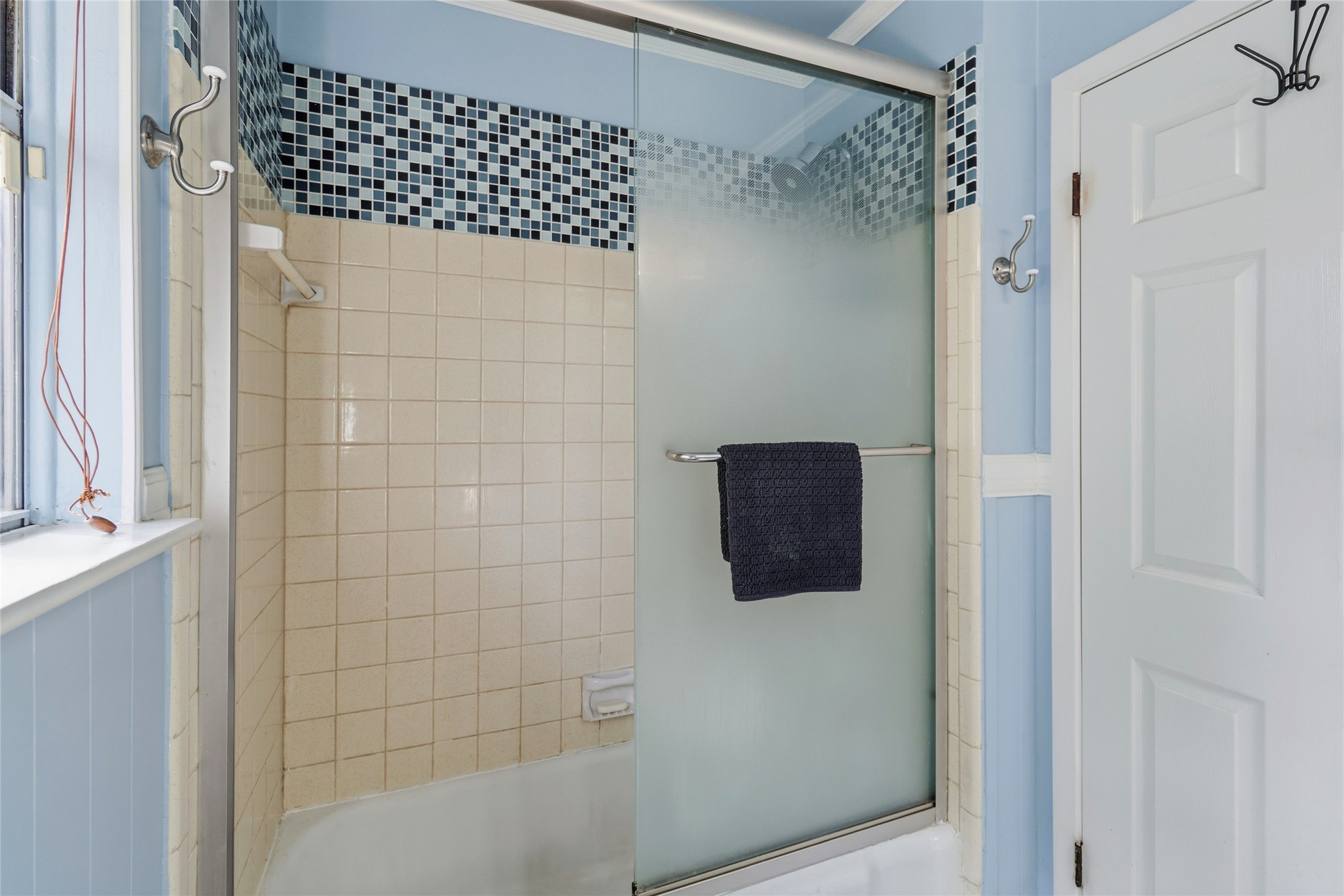 505 Lightsey Road Austin, TX 78704 - Photo 23 of 36 Bathroom featuring bath / shower combo with glass door