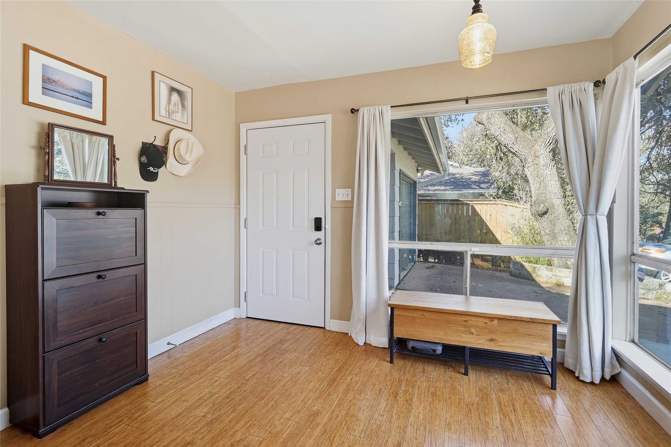 505 Lightsey Road Austin, TX 78704 - Photo 10 of 36 a room with wooden floor and a window