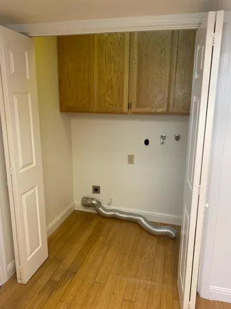 a bathroom with a sink vanity mirror and toilet