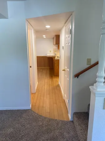 a view of a house with a chairs and deck