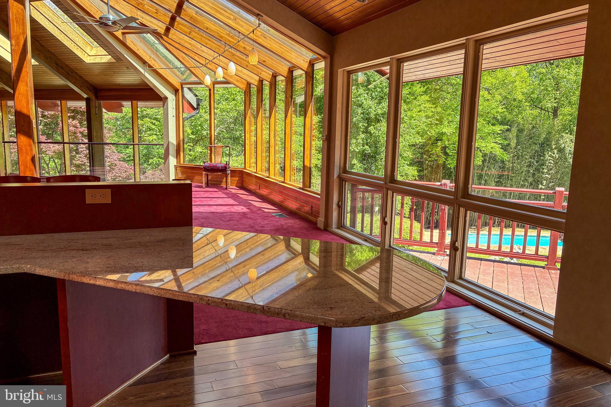 7211 Brickyard Road Potomac, MD 20854 - Photo 20 of 46 a view of an empty room with wooden floor and windows