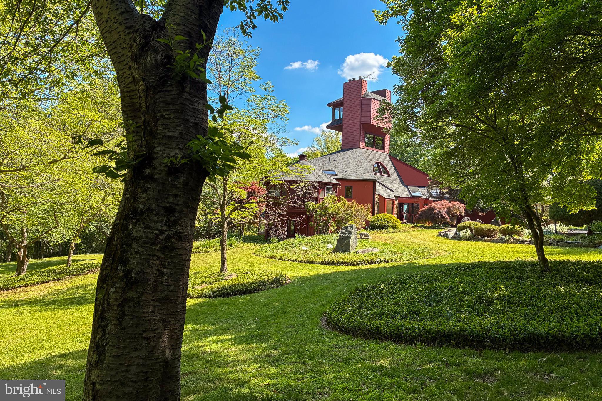 7211 Brickyard Road Potomac, MD 20854 - Photo 2 of 46 a view of a garden with a house